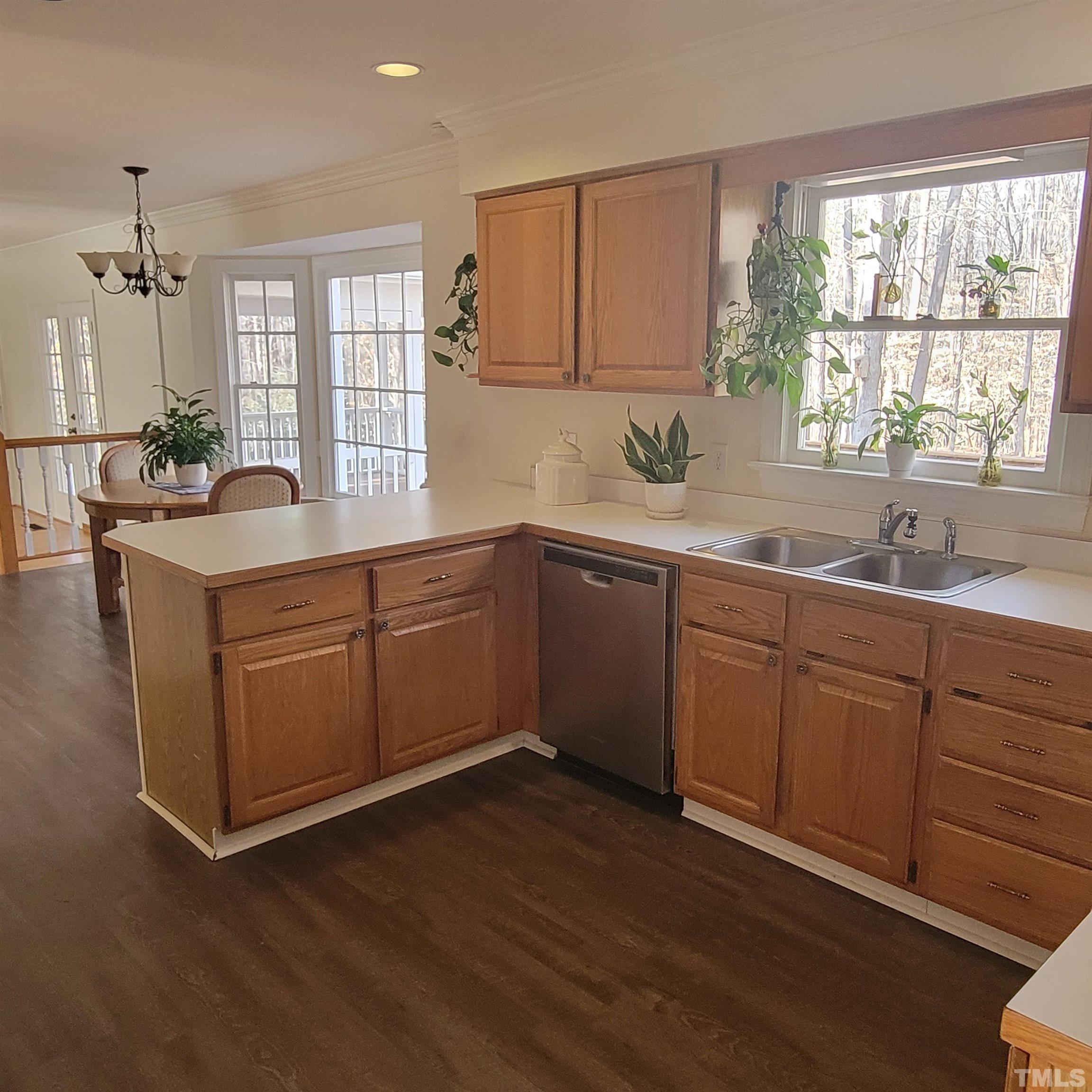 11817 Pembridge Lane Raleigh, NC 27613 - Photo 8 of 40 a kitchen with sink and window