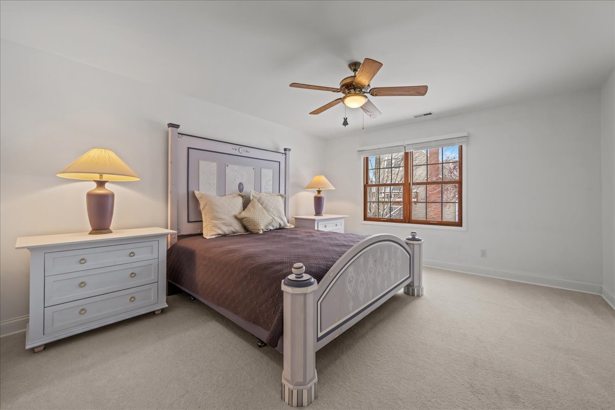 231 Sedgewick Circle St. Charles, IL 60174 - Photo 13 of 24 a spacious bedroom with a bed a window and dresser