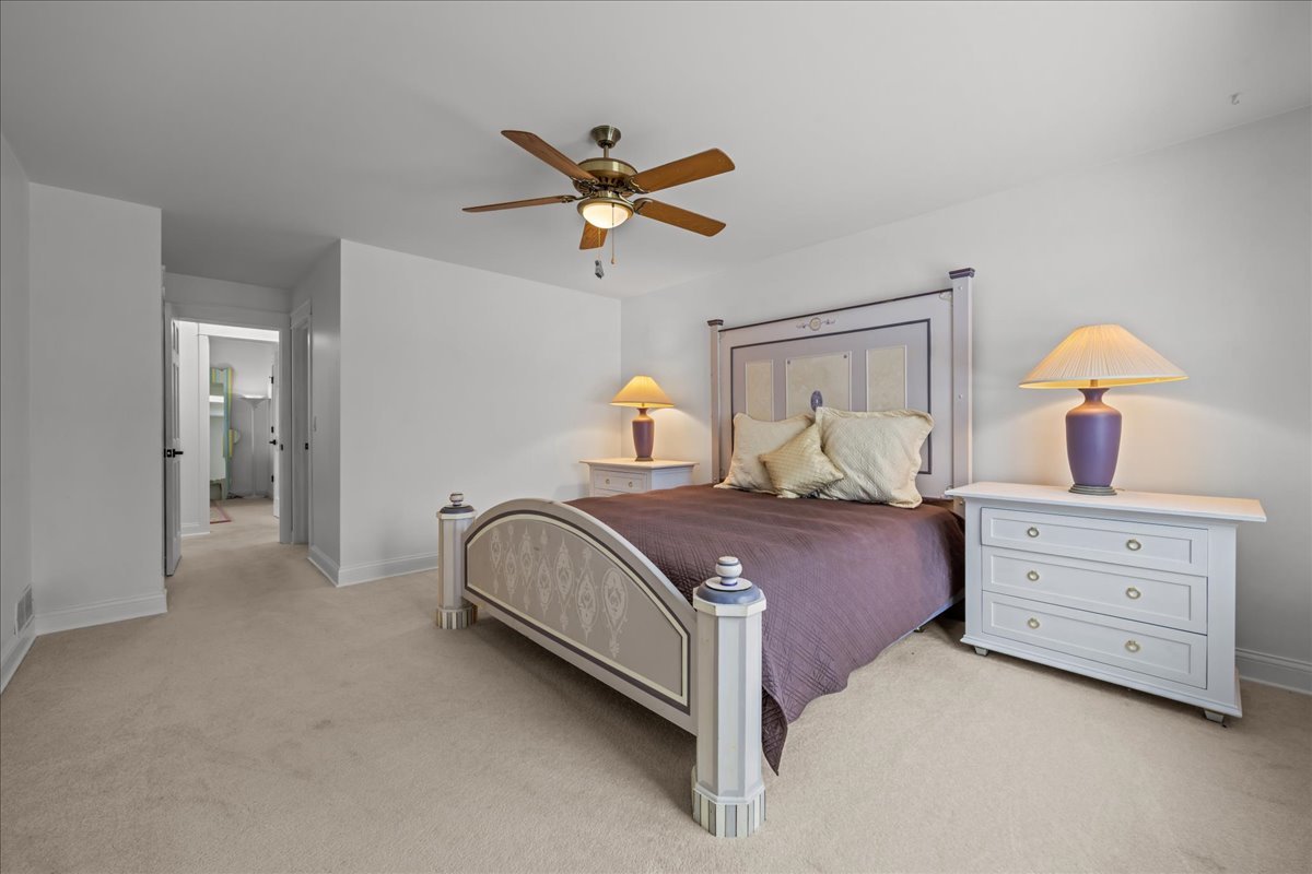 231 Sedgewick Circle St. Charles, IL 60174 - Photo 14 of 24 a bedroom with a bed and a chandelier