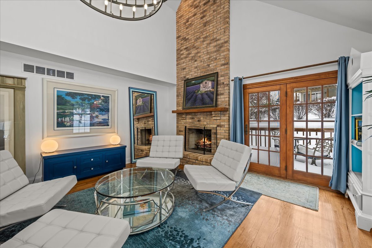 231 Sedgewick Circle St. Charles, IL 60174 - Photo 5 of 24 a living room with furniture a fireplace and a large window