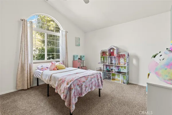 a bed room with a bed and a window