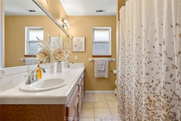 a bathroom with a sink a vanity and a mirror