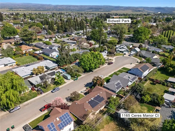 an aerial view of residential houses with outdoor space