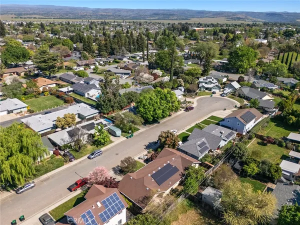 an aerial view of residential houses with outdoor space