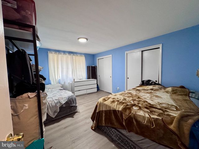 a bedroom with bed and a window