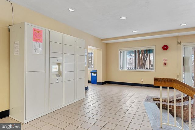 a view of hallway with stairs and furniture