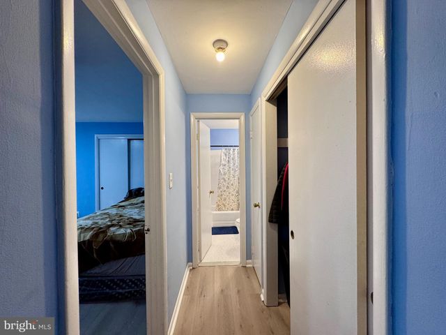a bath room with a toilet a sink and a bath tub