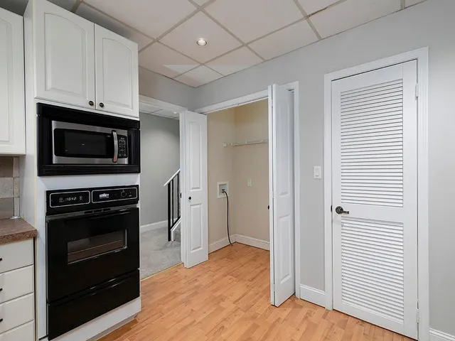 a kitchen with stainless steel appliances granite countertop a stove and a refrigerator