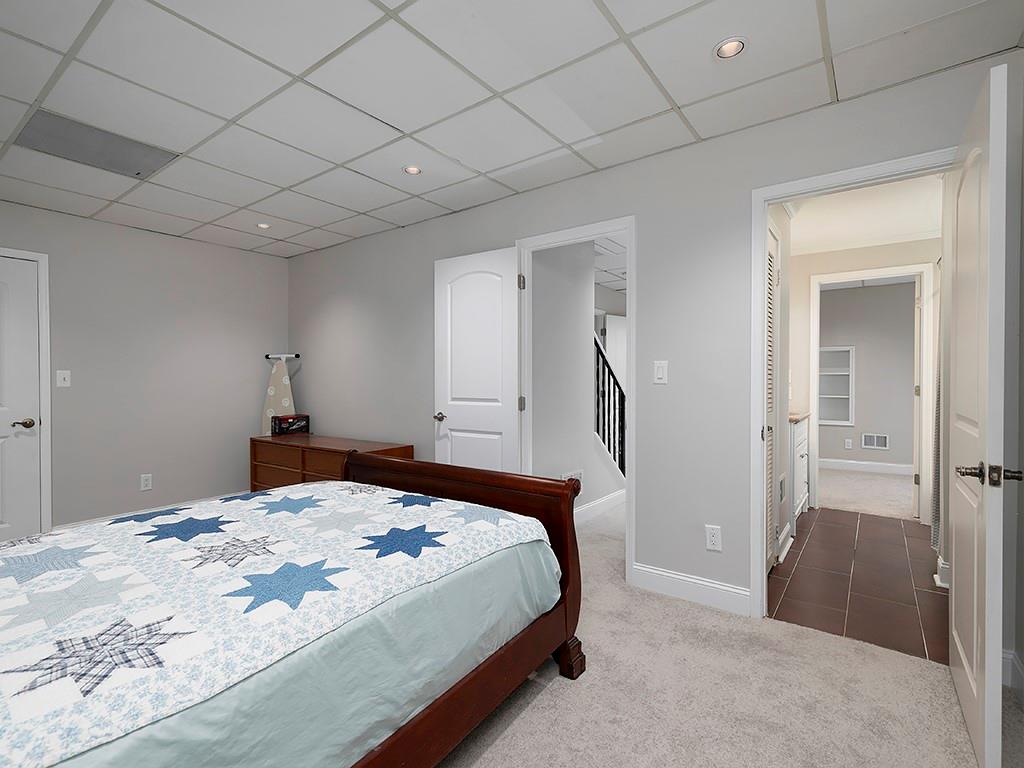 2270 Pilgrim Mill Way Cumming, GA 30041 - Photo 20 of 21 a bedroom with a bed and a table