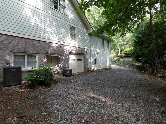 a view of a house with a yard and plants