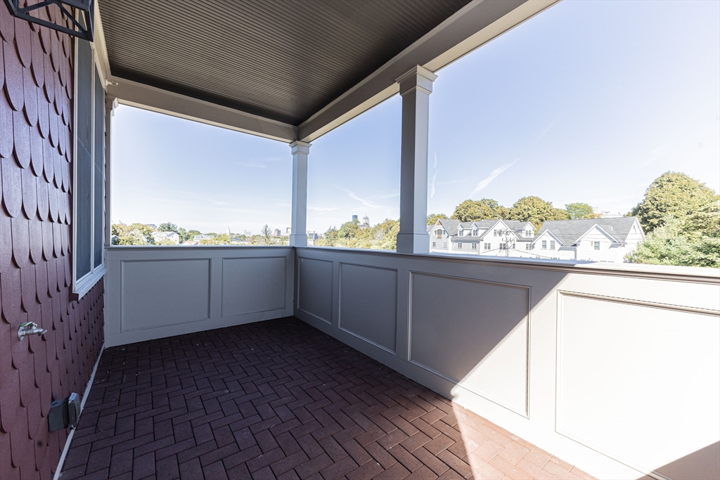 85 Regent Street, Unit 8 Boston, MA 02119 - Photo 29 of 30 a view of a balcony and front door