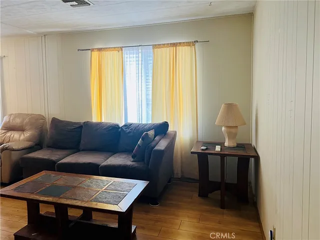 a bedroom with a bed and dresser