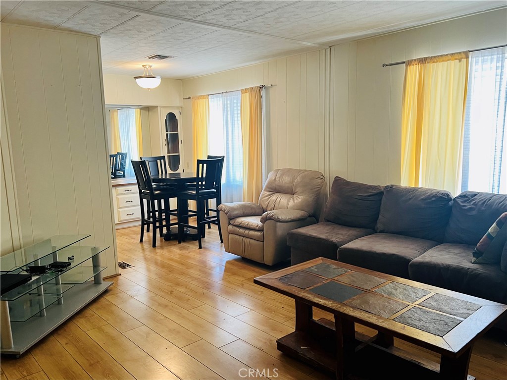 26200 Frampton Avenue, Unit 74 Harbor City, CA 90710 - Photo 13 of 19 a living room with furniture and a window