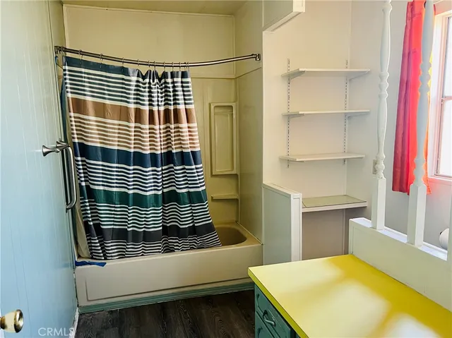 a view of a bathroom from a hallway