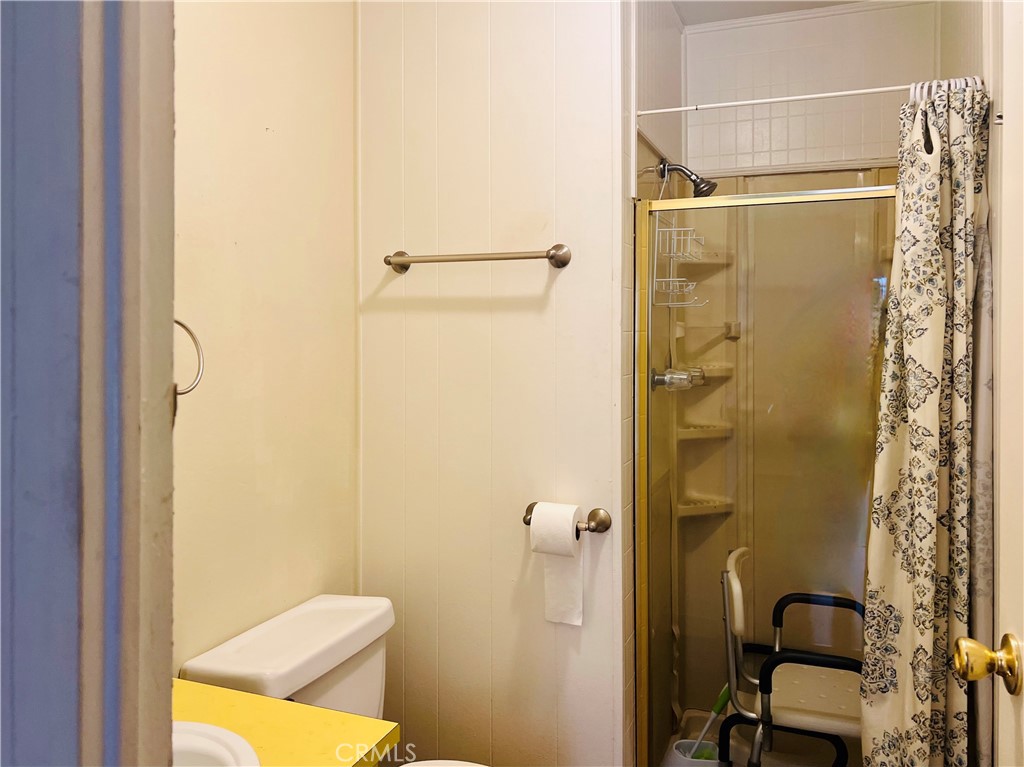 26200 Frampton Avenue, Unit 74 Harbor City, CA 90710 - Photo 18 of 19 a bathroom with a shower and a toilet