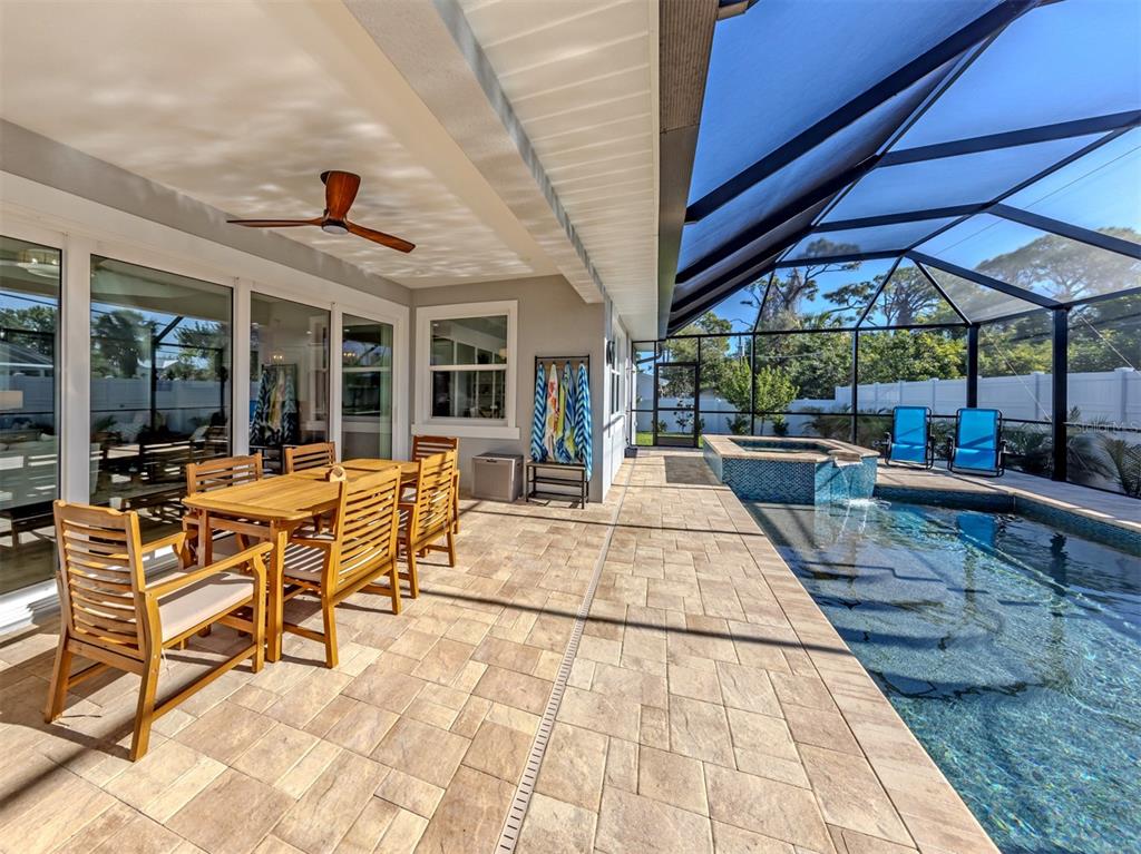 851 Linden Road Venice, FL 34293 - Photo 12 of 48 a view of a patio with table and chairs under an umbrella