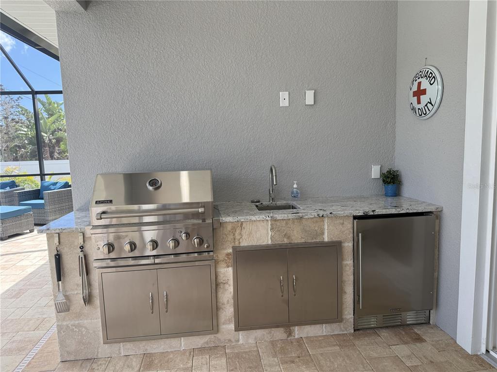 851 Linden Road Venice, FL 34293 - Photo 13 of 48 a kitchen with a stove and a microwave