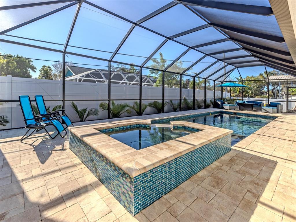 851 Linden Road Venice, FL 34293 - Photo 16 of 48 a view of a swimming pool with a patio