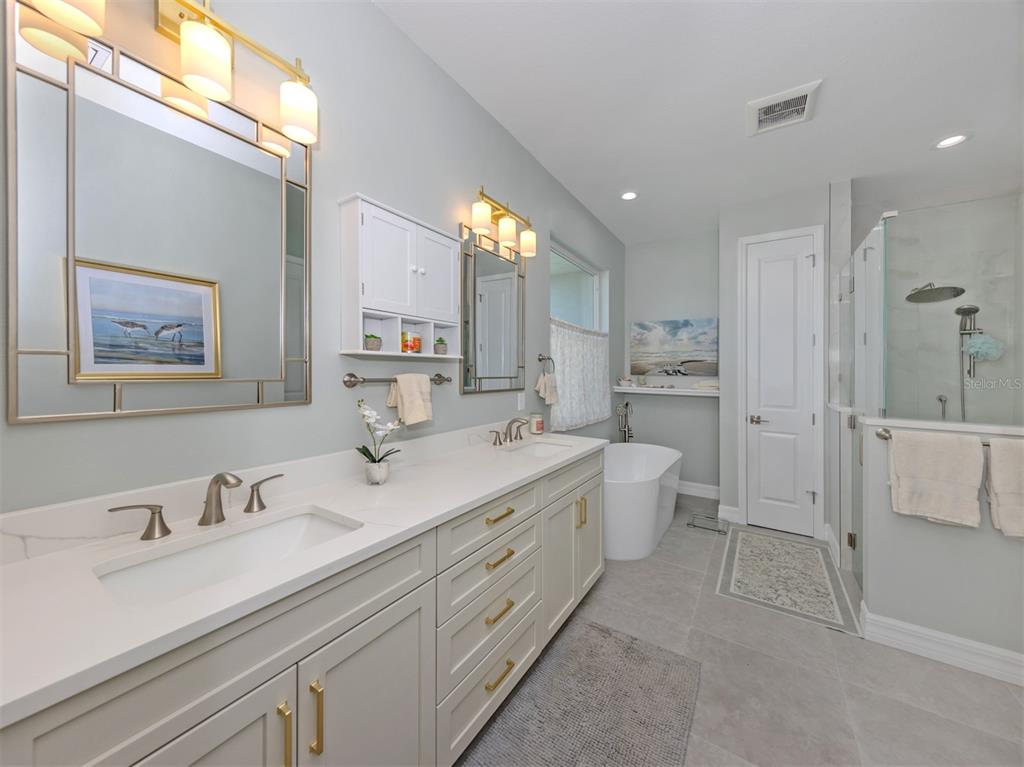 851 Linden Road Venice, FL 34293 - Photo 18 of 48 a spacious bathroom with a double vanity sink mirror and toilet