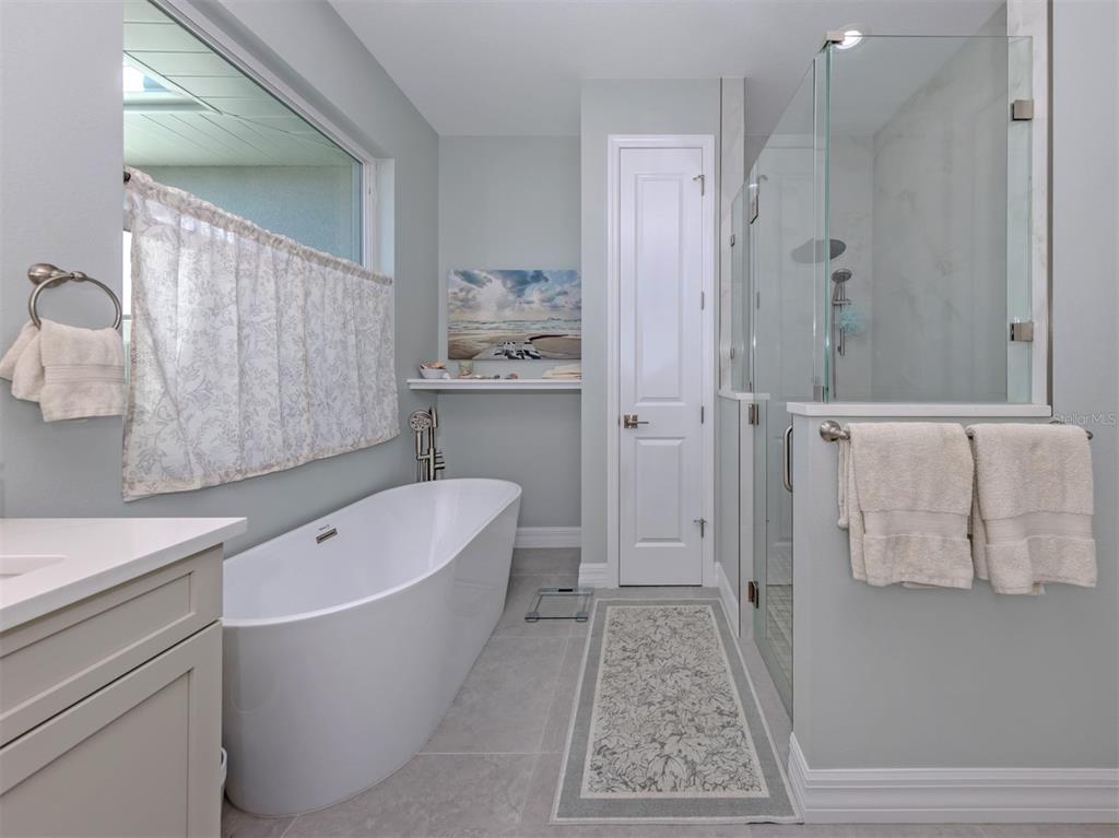 851 Linden Road Venice, FL 34293 - Photo 19 of 48 a bathroom with a bathtub and shower