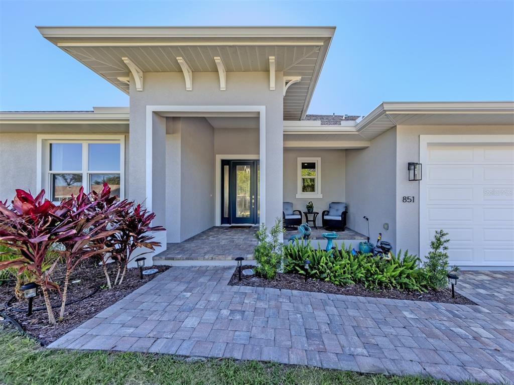 851 Linden Road Venice, FL 34293 - Photo 3 of 48 a front view of a house with a porch