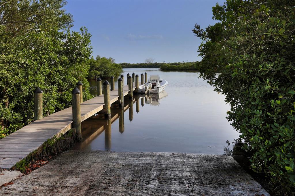 851 Linden Road Venice, FL 34293 - Photo 34 of 48 a view of a lake with a mountain in the background