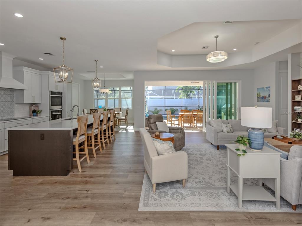 851 Linden Road Venice, FL 34293 - Photo 4 of 48 a living room with lots of furniture and a large window