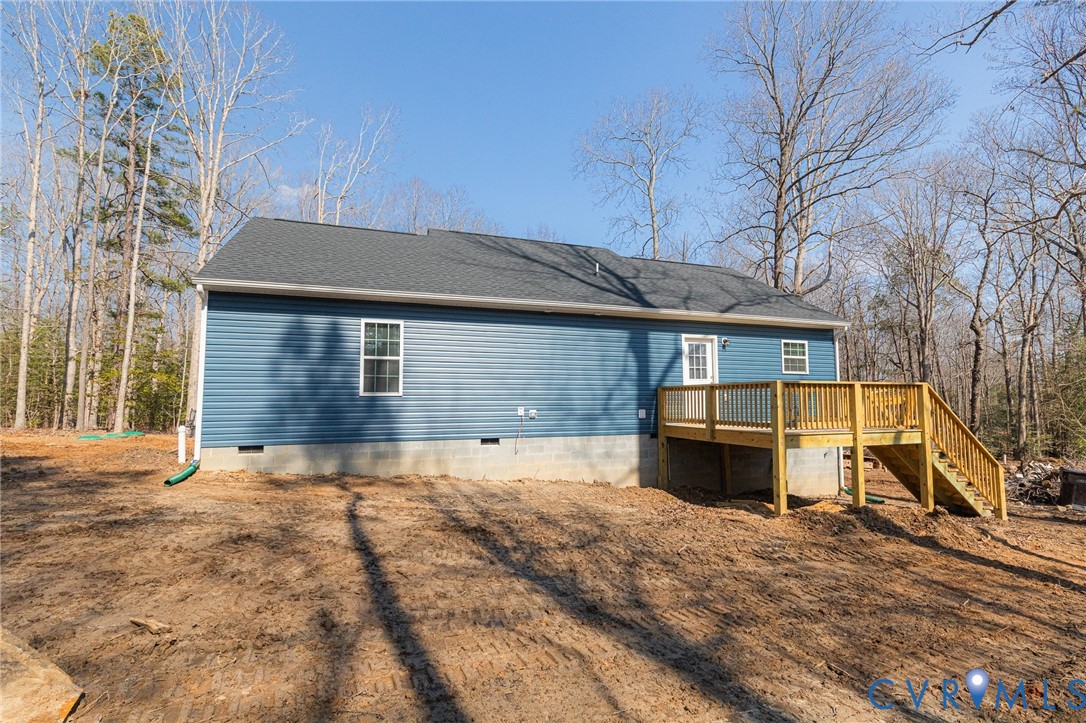5301 Pine Fork Road Quinton, VA 23141 - Photo 7 of 41 a front view of a house with a yard and garage