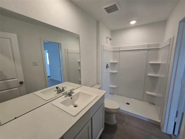 a house that has a tree in front of it