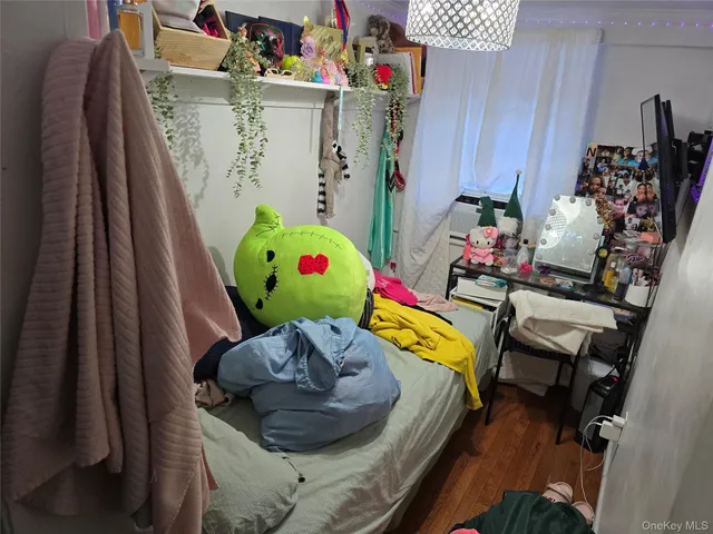 a bedroom with a bed and a furniture