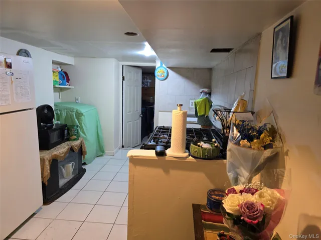 a kitchen with a stove and a fireplace