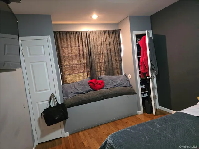 a living room with a couch and a ceiling fan