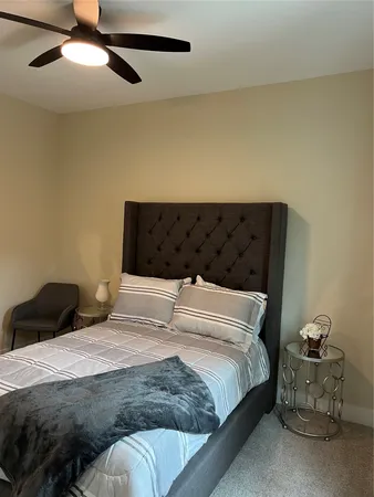 a bedroom with a bed and window