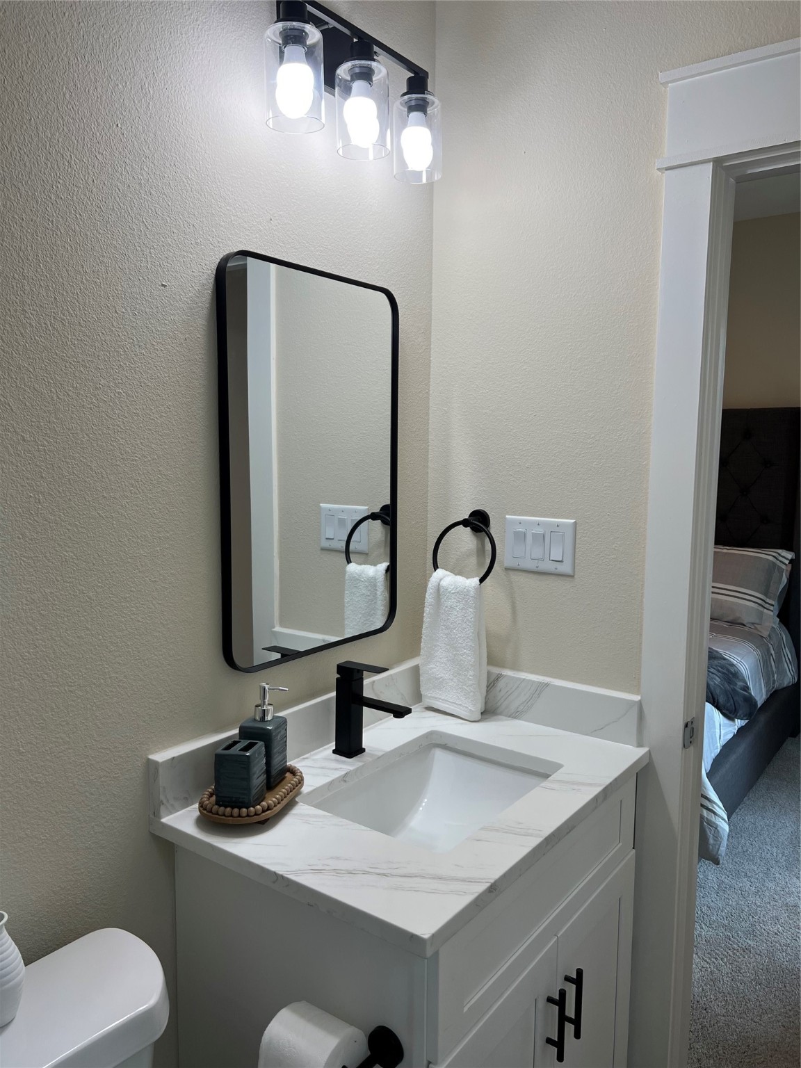 9441 Radio Road, Unit B Houston, TX 77075 - Photo 15 of 17 a bathroom with a toilet sink and mirror