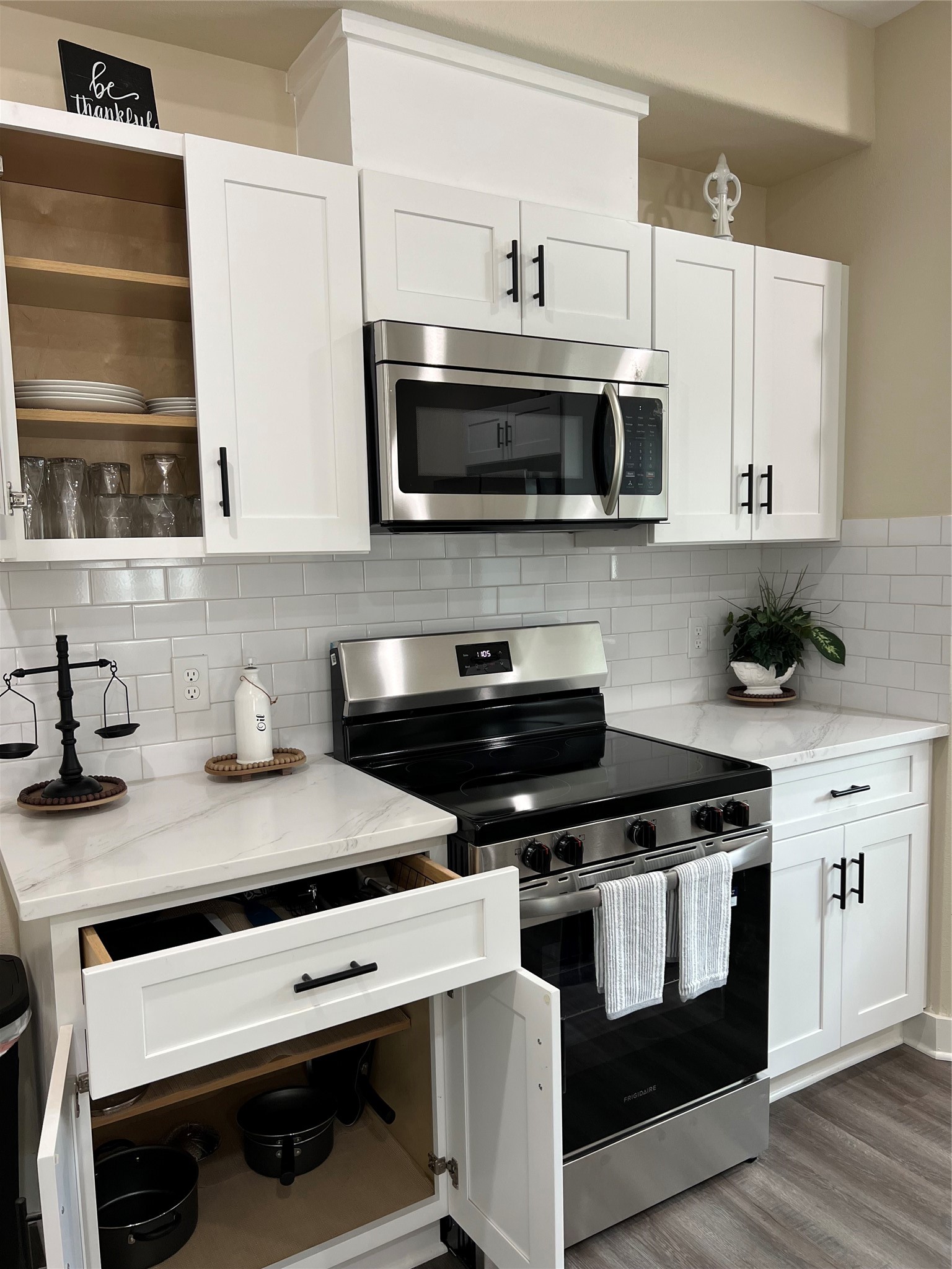 9441 Radio Road, Unit B Houston, TX 77075 - Photo 7 of 17 a kitchen with stainless steel appliances a stove a sink and a microwave