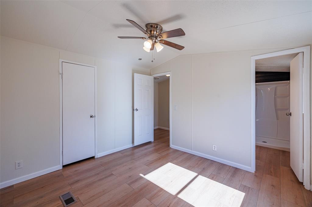 720 Jupiter Avenue Granbury, TX 76049 - Photo 19 of 23 a view of an empty room with wooden floor