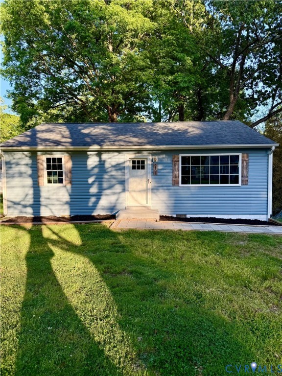 a view of a house with pool and a yard