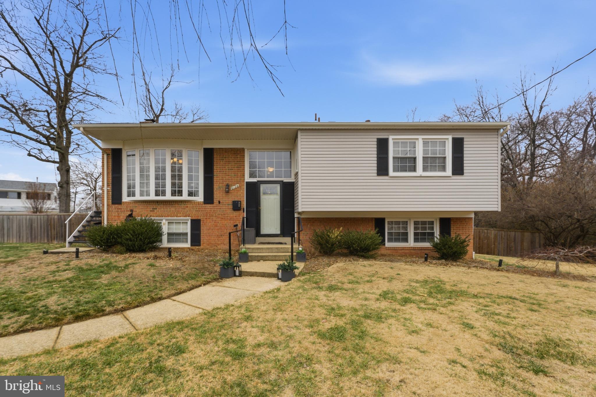 6124 Crozet Court Springfield, VA 22150 - Photo 1 of 57 a front view of a house with a yard