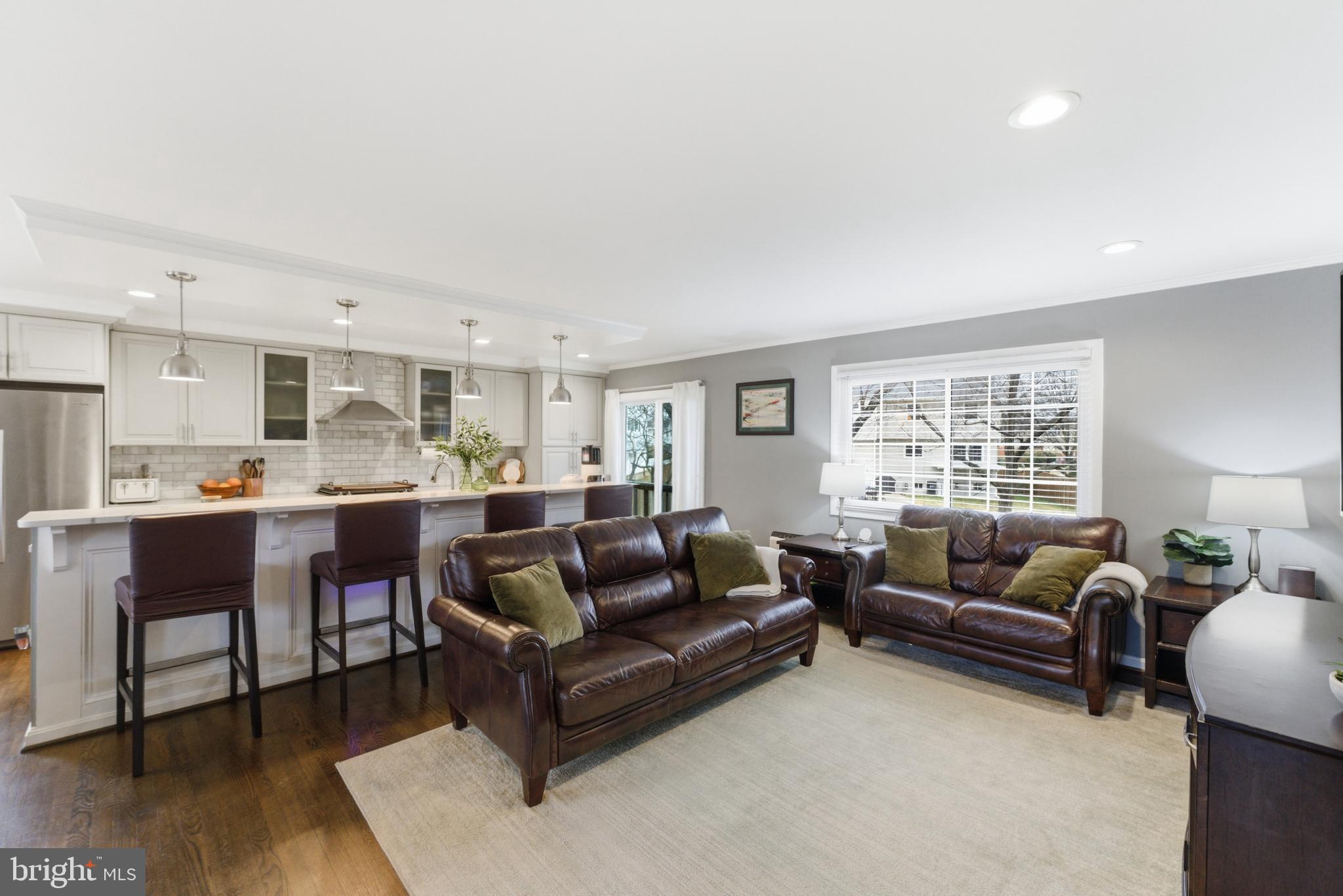 6124 Crozet Court Springfield, VA 22150 - Photo 11 of 57 a living room with furniture and kitchen view