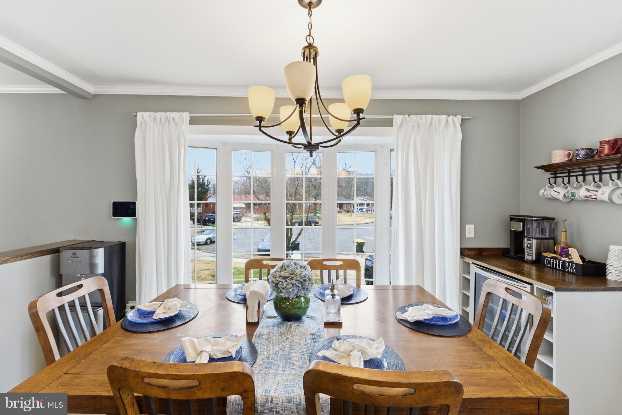 6124 Crozet Court Springfield, VA 22150 - Photo 15 of 57 a dining room with furniture a rug and wooden floor