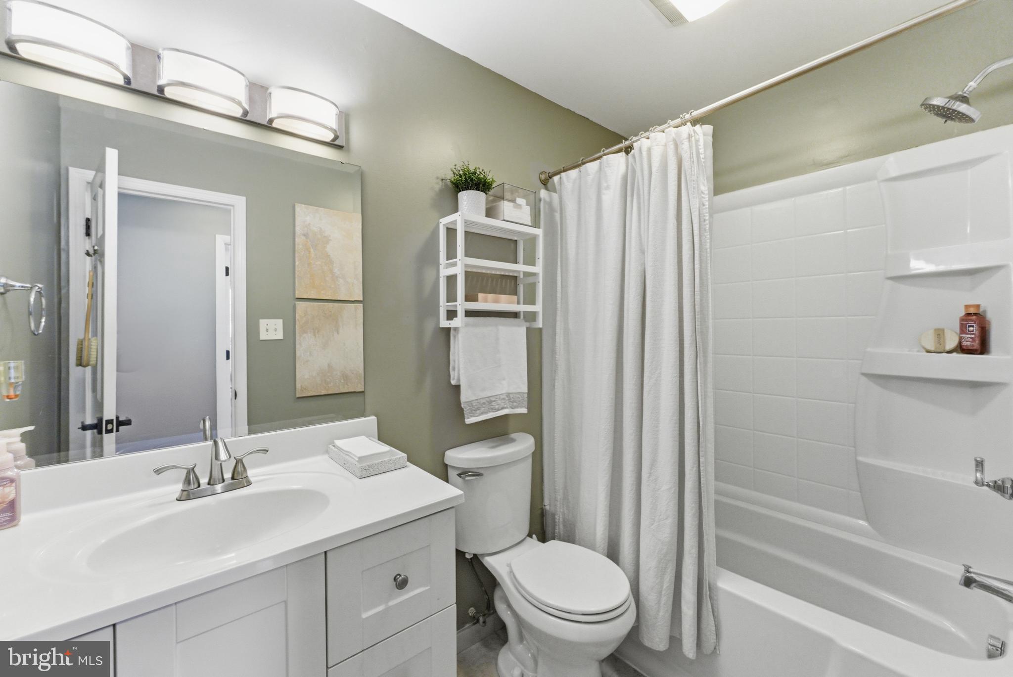 6124 Crozet Court Springfield, VA 22150 - Photo 18 of 57 a bathroom with a sink a toilet and shower