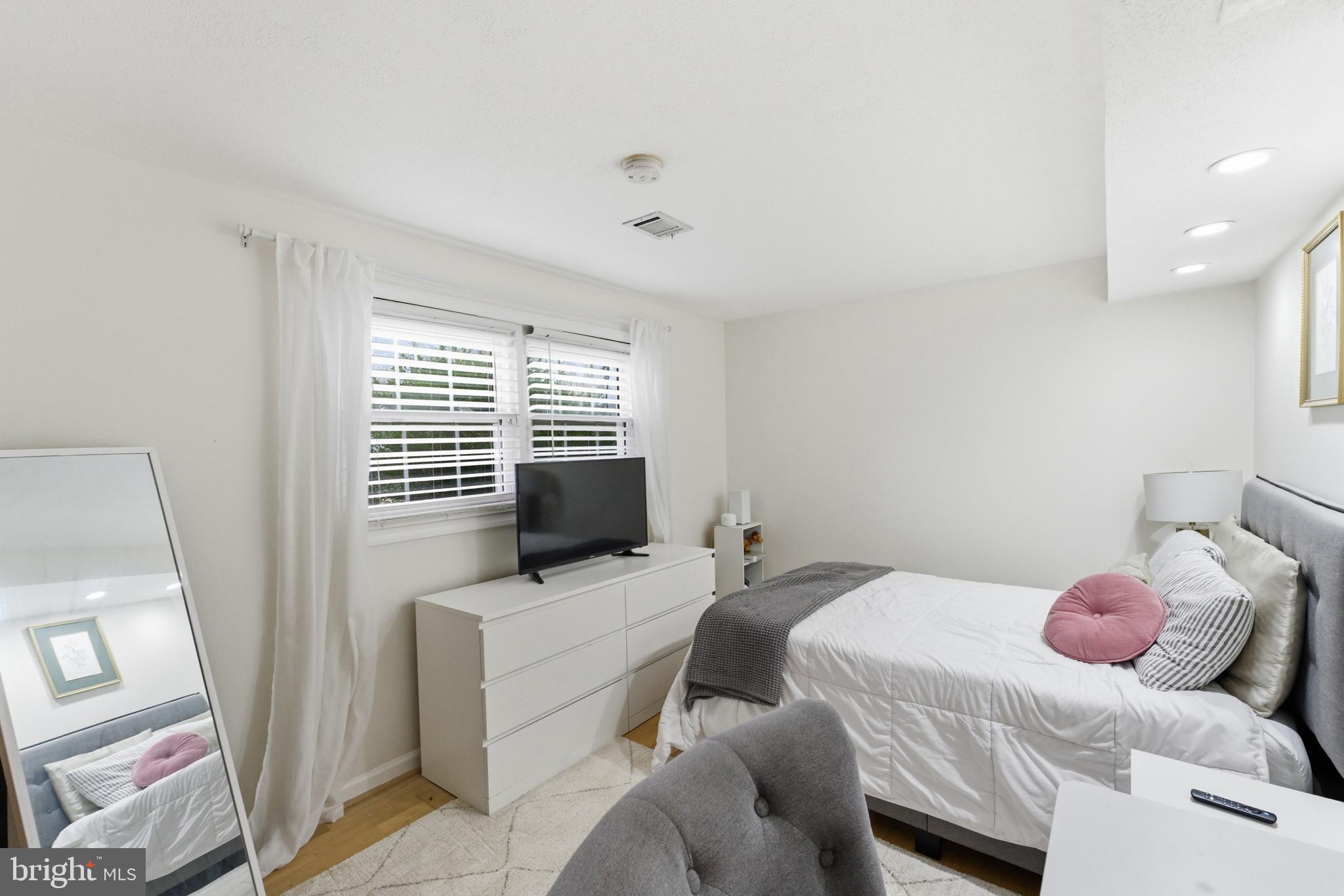6124 Crozet Court Springfield, VA 22150 - Photo 29 of 57 a bedroom with a bed and a window