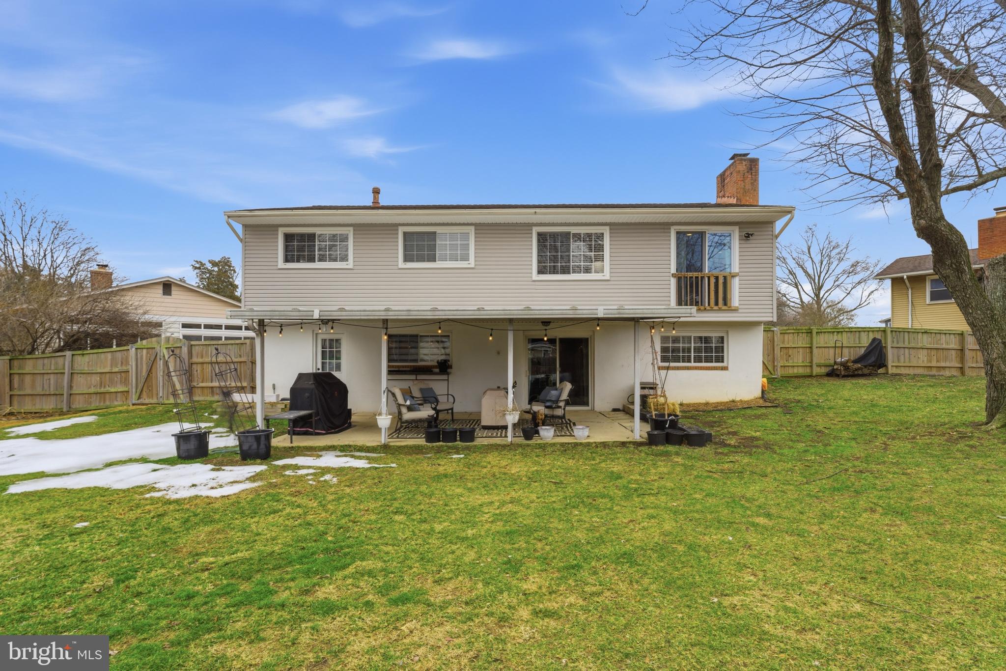 6124 Crozet Court Springfield, VA 22150 - Photo 45 of 57 a group of people sitting in front of a house