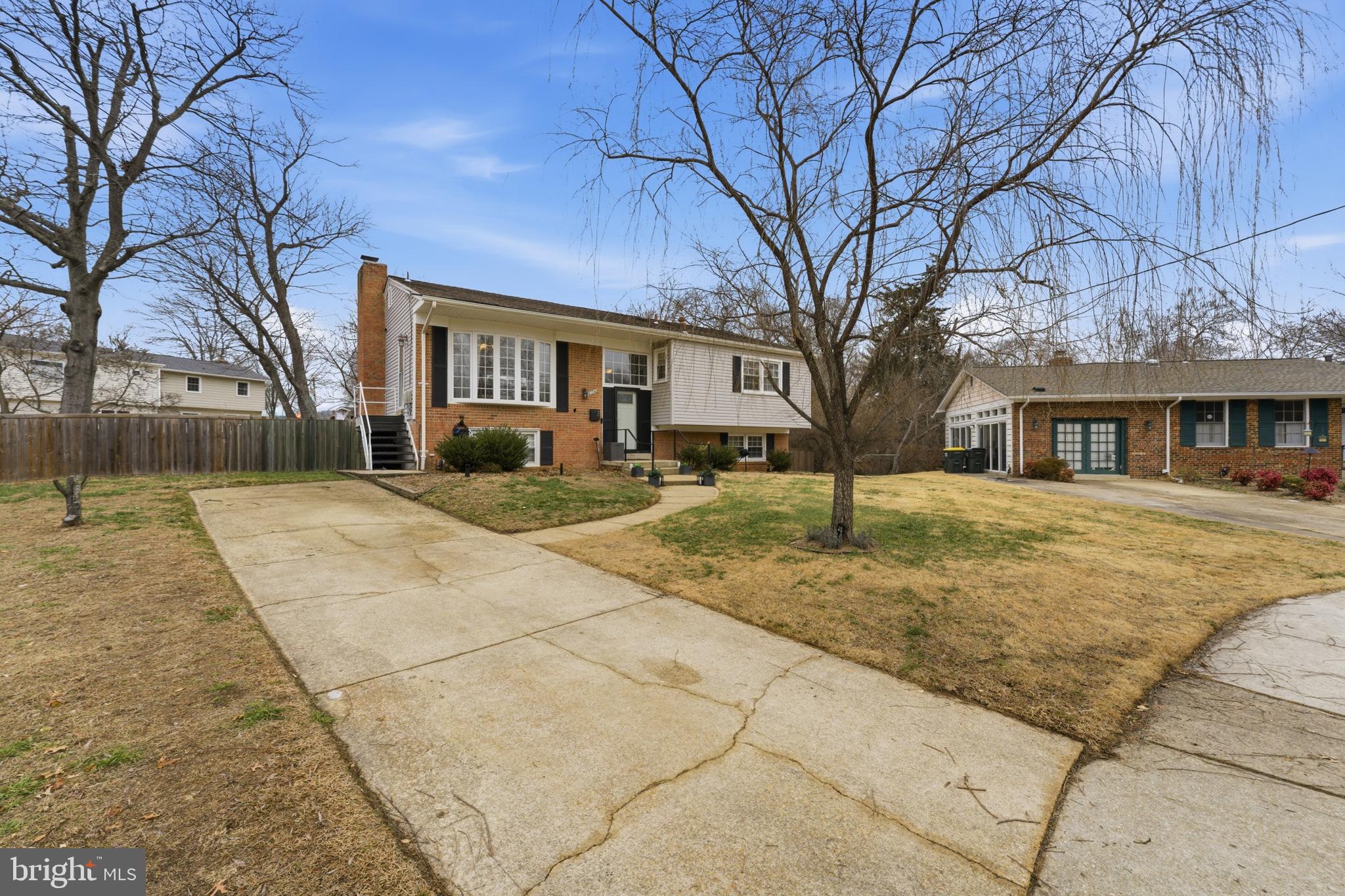 6124 Crozet Court Springfield, VA 22150 - Photo 51 of 57 a front view of a house with a yard