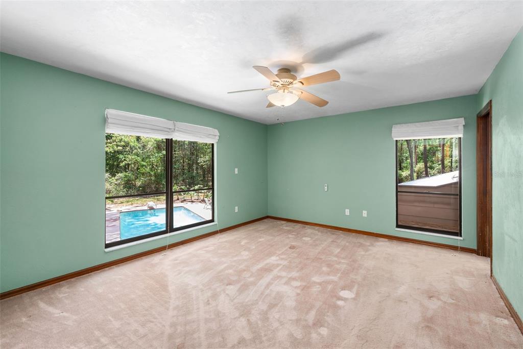 4703 Northwest 124th Street Gainesville, FL 32606 - Photo 31 of 55 an empty room with windows and closet