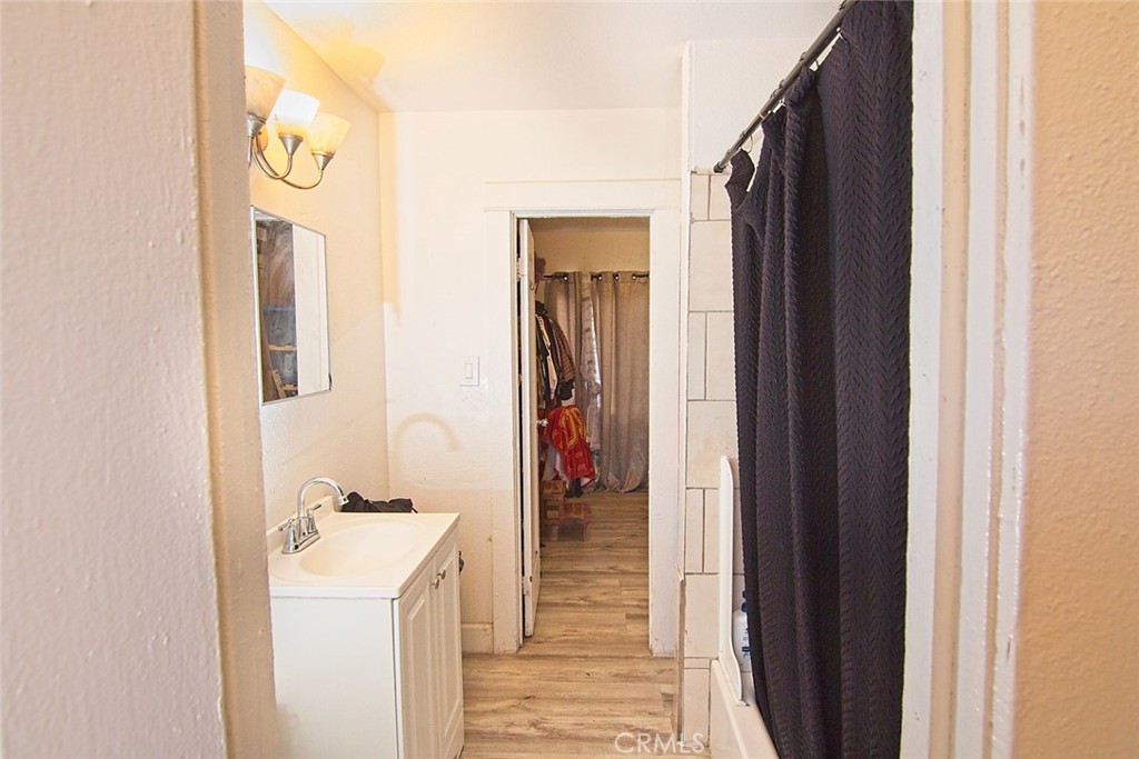 6905 Compton Avenue Los Angeles, CA 90001 - Photo 22 of 26 a view of hallway with wooden floor