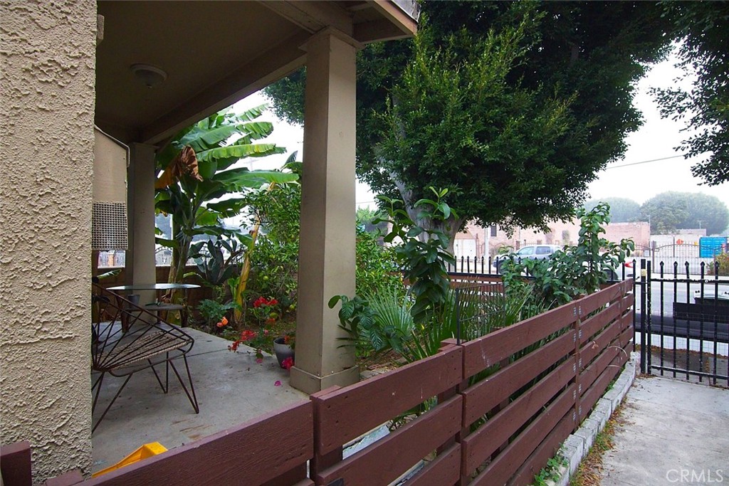 6905 Compton Avenue Los Angeles, CA 90001 - Photo 26 of 26 a view of balcony with wooden floor