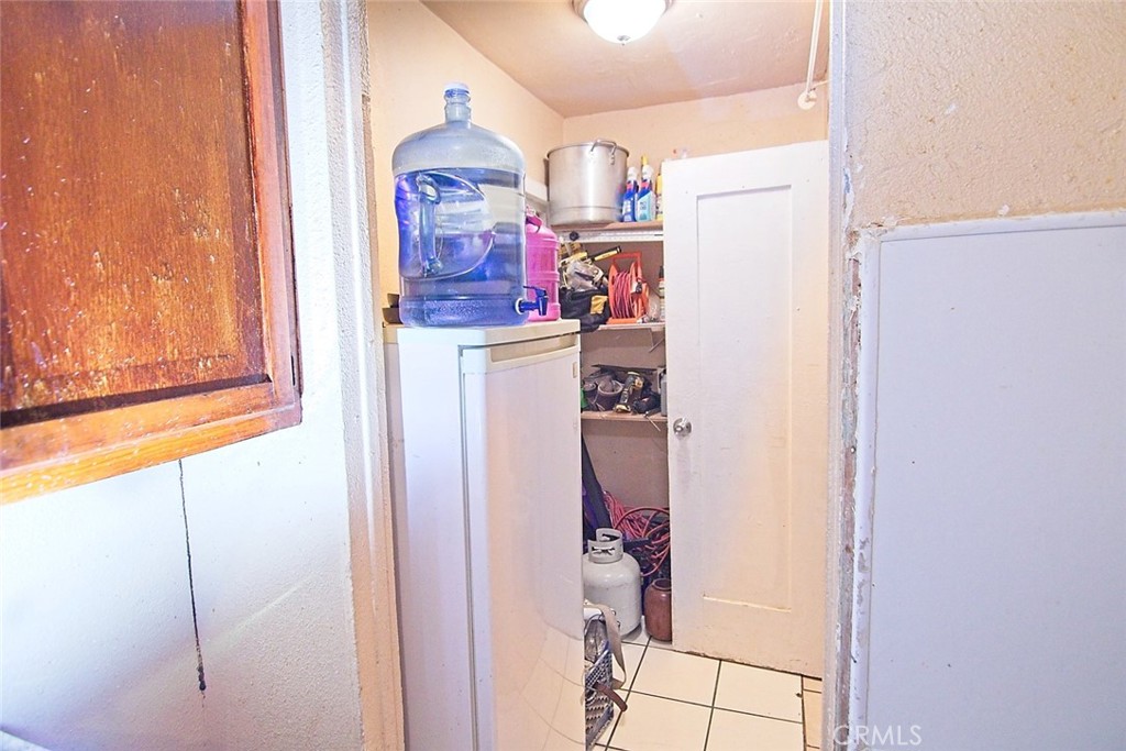 6905 Compton Avenue Los Angeles, CA 90001 - Photo 6 of 26 a room with storage and utility