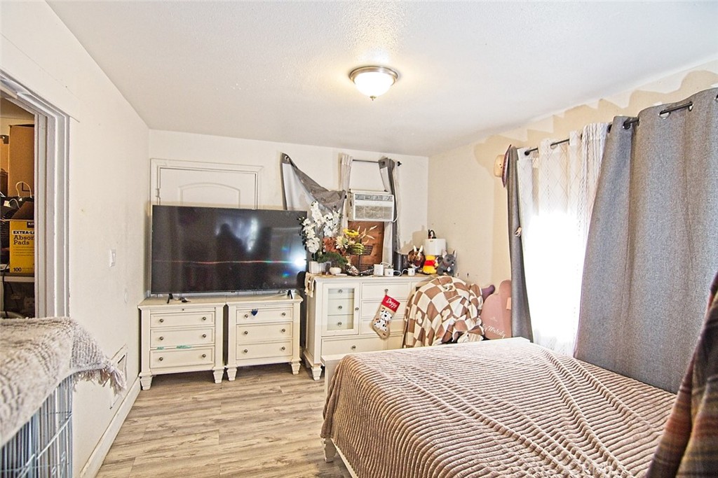 6905 Compton Avenue Los Angeles, CA 90001 - Photo 7 of 26 a view of a livingroom with furniture and a flat screen tv