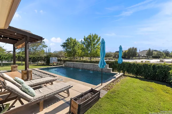 a view of a swimming pool with a patio